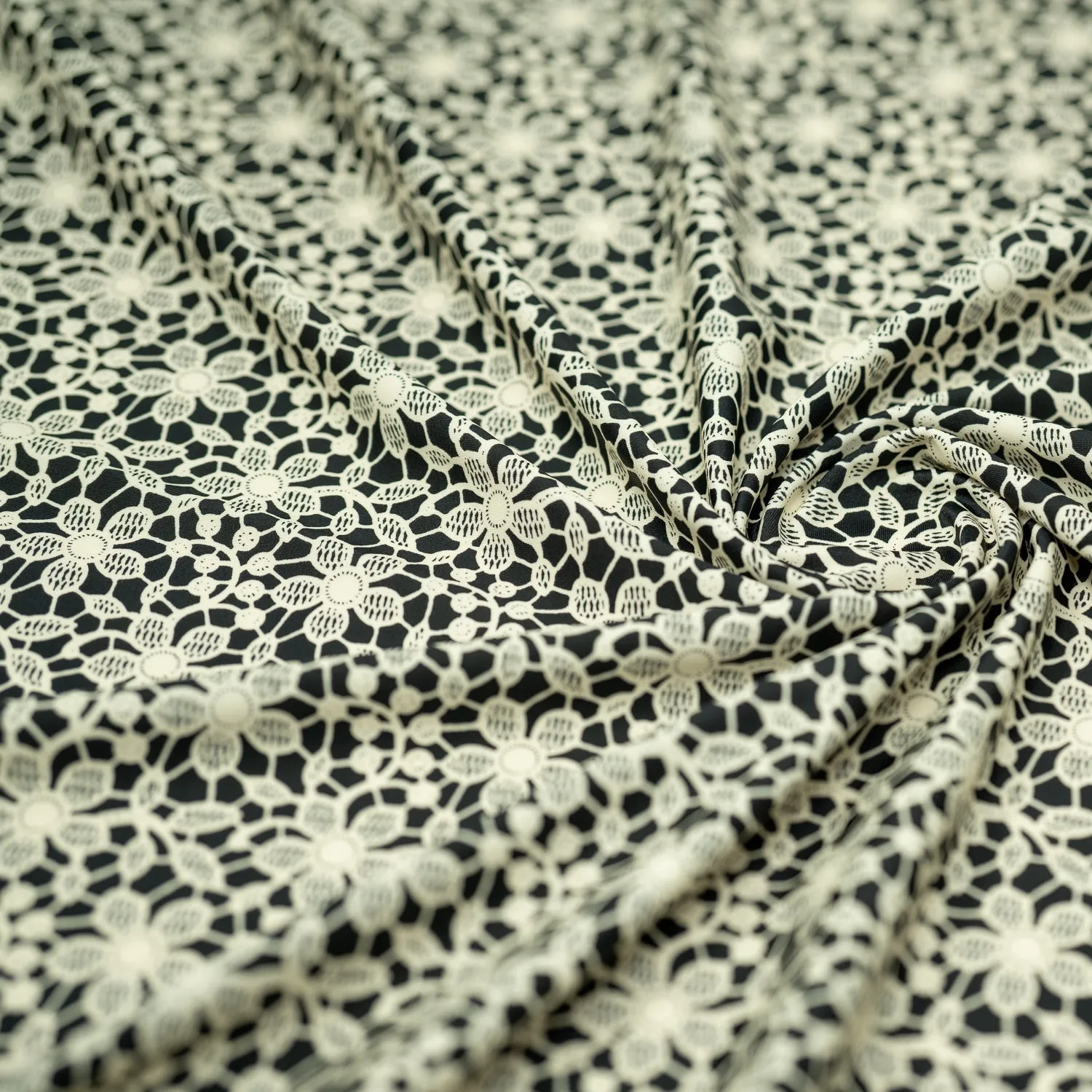 Ivory Flower Lace Pattern on Black Printed Spandex Fabric | Blue Moon Fabrics