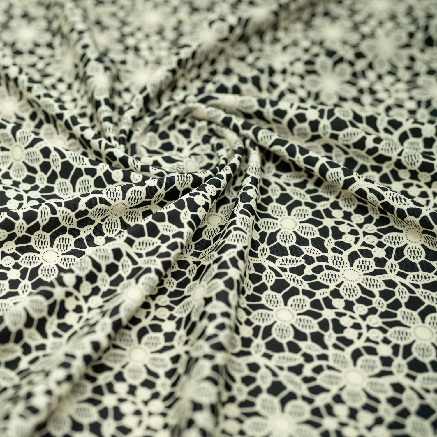 Ivory Flower Lace Pattern on Black Printed Spandex Fabric | Blue Moon Fabrics