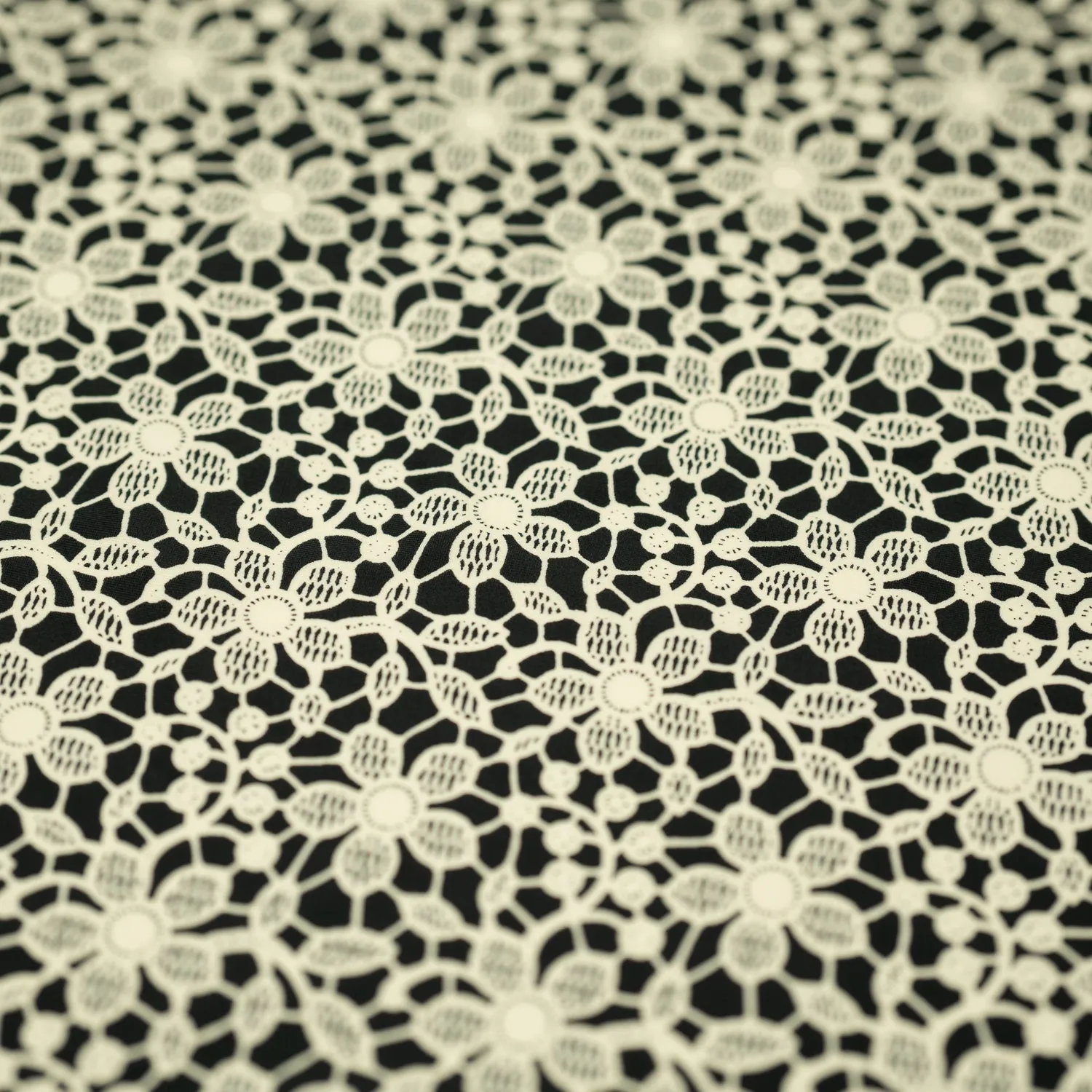 Ivory Flower Lace Pattern on Black Printed Spandex Fabric | Blue Moon Fabrics