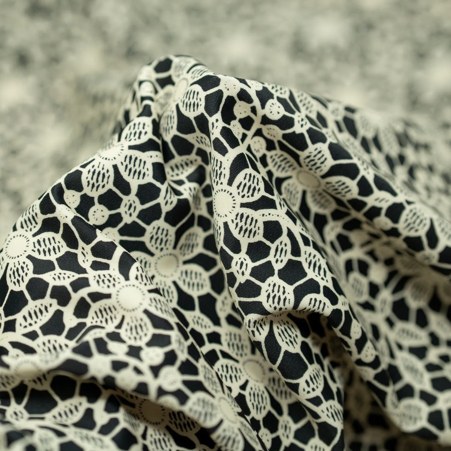 Ivory Flower Lace Pattern on Black Printed Spandex Fabric | Blue Moon Fabrics