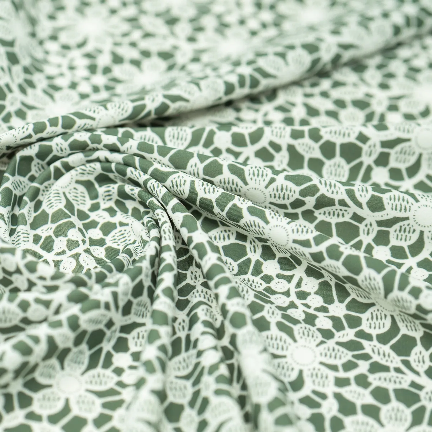 White Flower Lace Pattern on Sage Printed Spandex Fabric | Blue Moon Fabrics